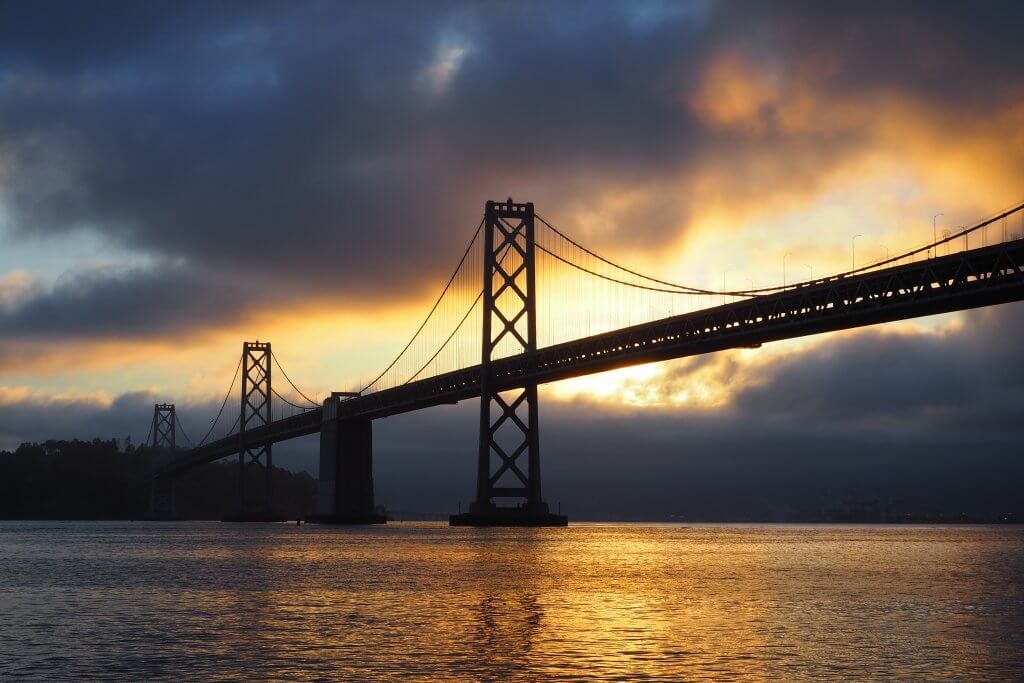 bridge storm sunset