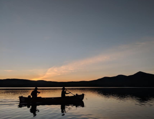 Canoe sunset lake